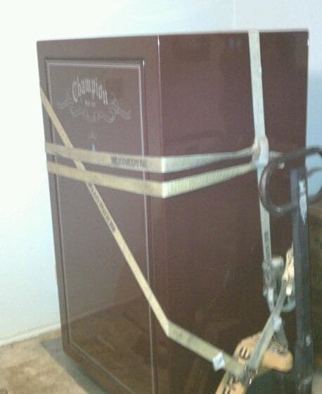 Champion gun safe with boltwork, lock and handle removed ready to move out of a bedroom