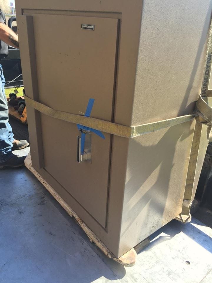 Very heavy Hamilton TL-15 bank safe being moved out of a bank on a pallet jack