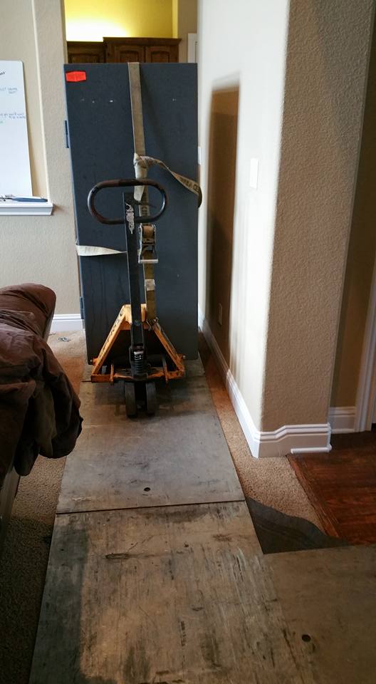 Moving a Heritage gun safe from a home in Grand Prairie, TX into a home in Colleyville, TX, and placing it inside of a closet.