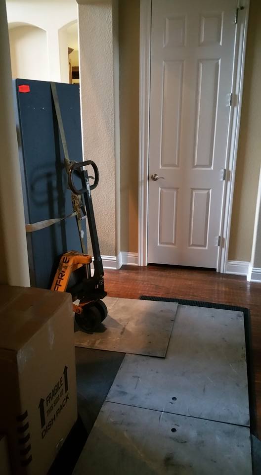 Moving a Heritage gun safe from a home in Grand Prairie, TX into a home in Colleyville, TX, and placing it inside of a closet.