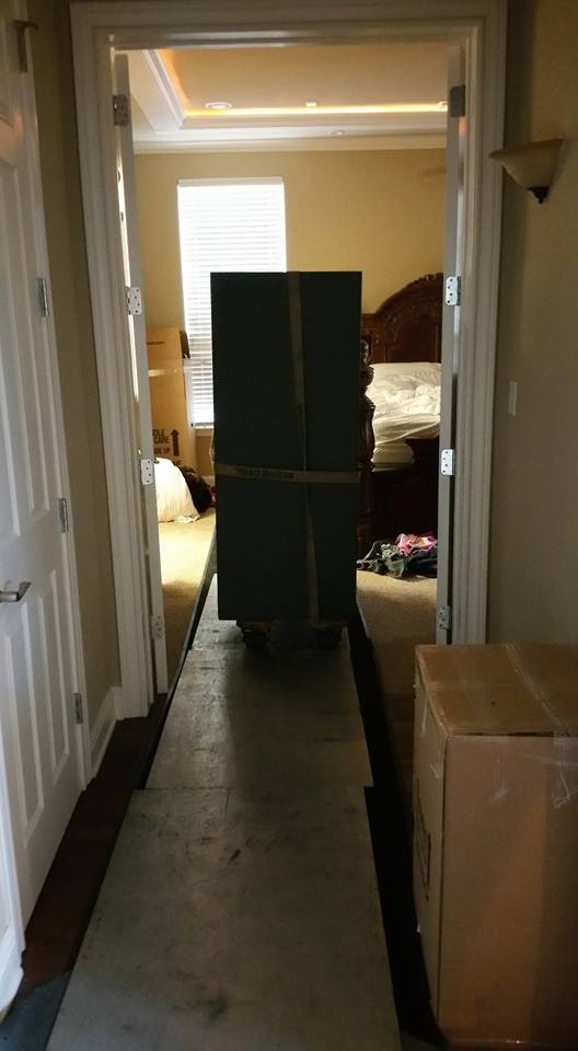 Moving a Heritage gun safe from a home in Grand Prairie, TX into a home in Colleyville, TX, and placing it inside of a closet.