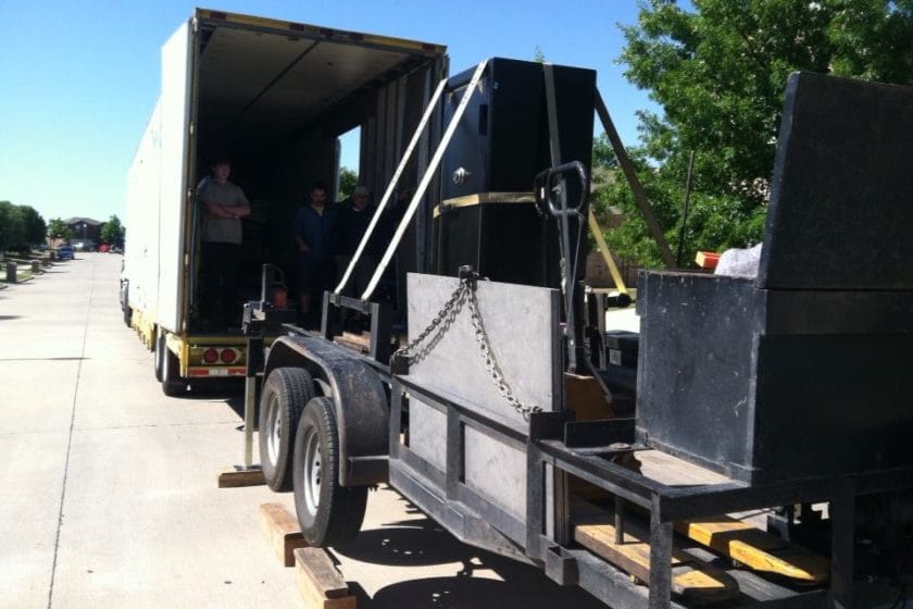 Our safe moving trailer raised up level with a tractor trailer and the gun safe moved onto our trailer 3