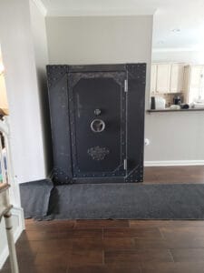 This pictures shows a safe installation in Fort Worth we did in a home of this very large Rhino Iron Works gun safe. No damage to this expensive tile floor either.