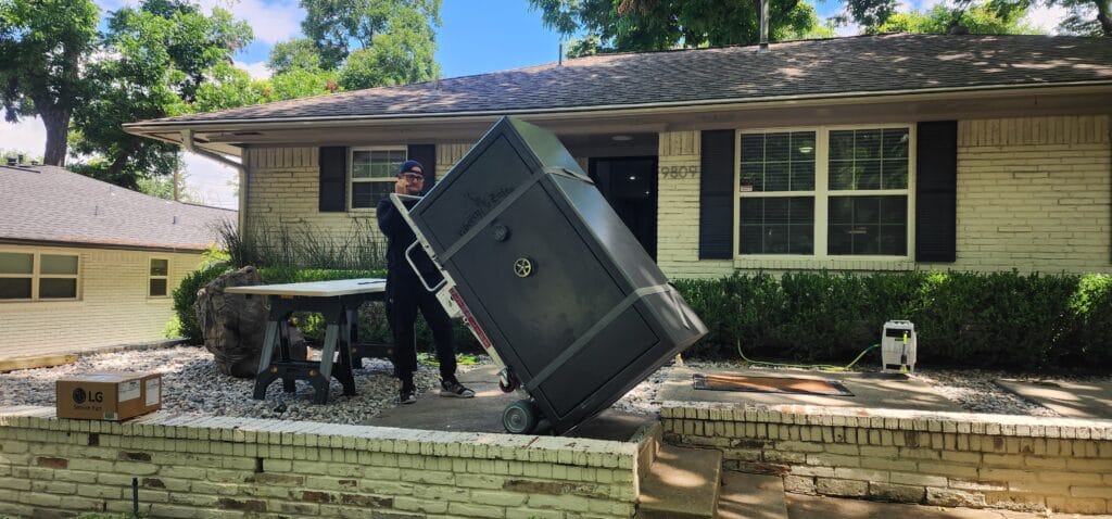 One of our safe services in Dallas, moving a Liberty Gun Safe out of a home and down some steps.